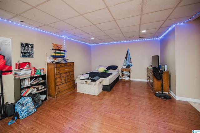 1121 Colonial Dr, Alabaster, AL 35007 - bedroom featuring a paneled ceiling, wood finished floors, baseboards, and recessed lighting