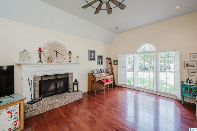 1121 Colonial Dr, Alabaster, AL 35007 - living room with ceiling fan, vaulted ceiling, wood finished floors, and a brick fireplace