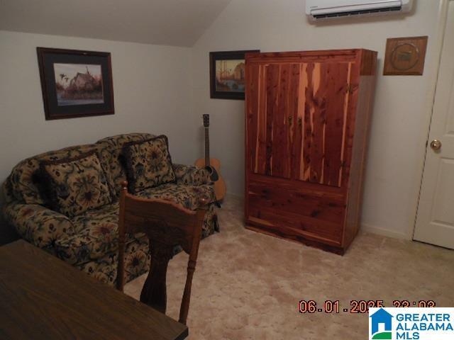 222 Odum Crest Ln, Hoover, AL 35226 - carpeted living room with a wall mounted air conditioner and vaulted ceiling