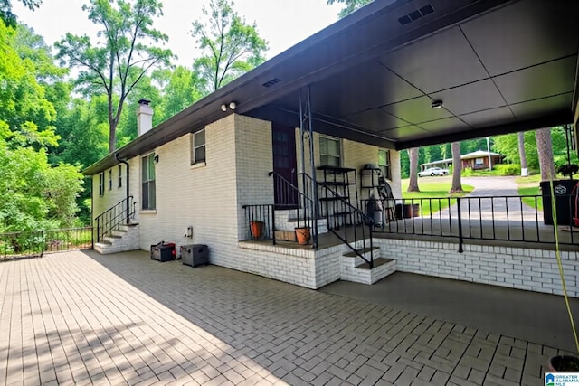3501 Pineland Dr, Birmingham, AL 35243 - view of property exterior with a chimney and brick siding