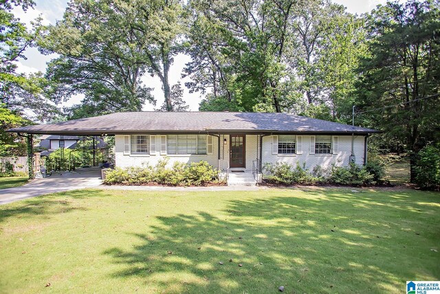 3501 Pineland Dr, Birmingham, AL 35243 - ranch-style home featuring asphalt driveway, a front yard, an attached carport, and brick siding