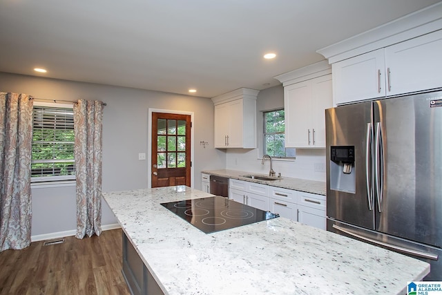 3501 Pineland Dr, Birmingham, AL 35243 - kitchen featuring stainless steel appliances, a sink, white cabinets, dark wood-type flooring, and a center island