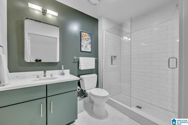 1801 2nd Ave N Unit 309, Birmingham, AL 35203 - full bathroom with toilet, a shower stall, vanity, and tile patterned flooring