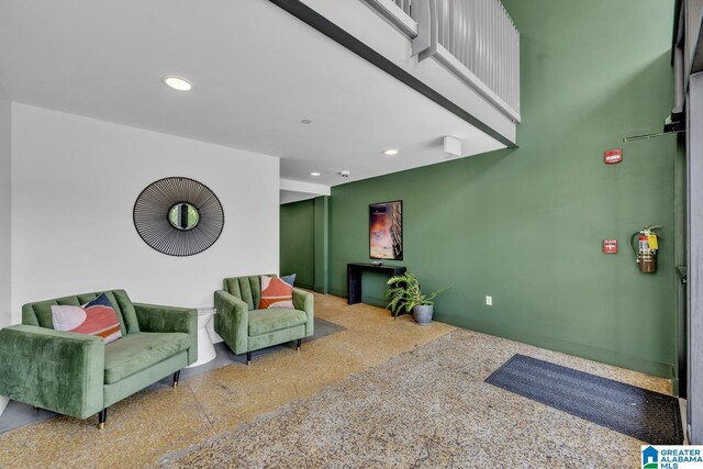 1801 2nd Ave N Unit 309, Birmingham, AL 35203 - living area featuring speckled floor and recessed lighting