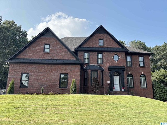 2032 Forest Meadows Cir, Birmingham, AL 35242 - view of front of property featuring a front yard, a standing seam roof, and brick siding