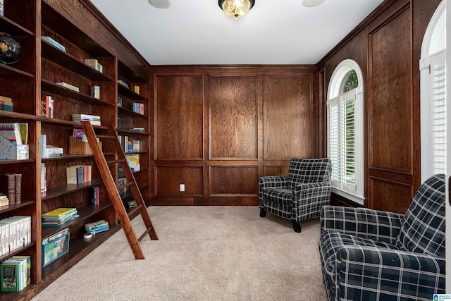 2032 Forest Meadows Cir, Birmingham, AL 35242 - living area featuring crown molding, wooden walls, and light colored carpet