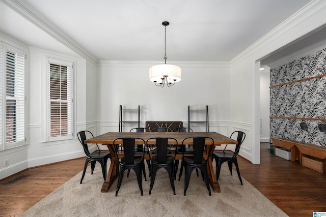 2032 Forest Meadows Cir, Birmingham, AL 35242 - dining room with wood finished floors, a chandelier, healthy amount of natural light, wainscoting, and crown molding