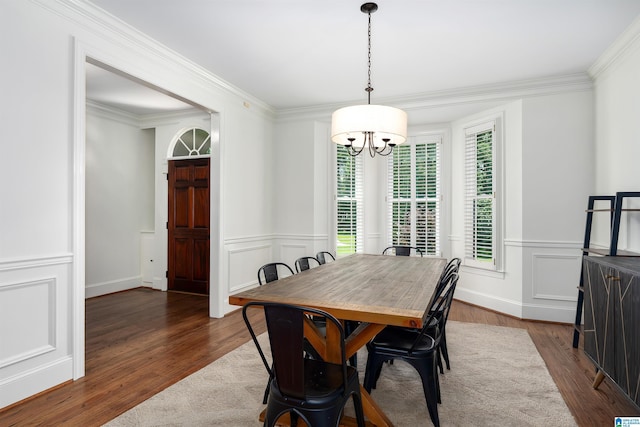 2032 Forest Meadows Cir, Birmingham, AL 35242 - dining room featuring a chandelier, dark wood finished floors, ornamental molding, a decorative wall, and a wainscoted wall