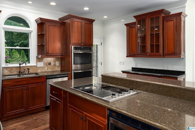 2032 Forest Meadows Cir, Birmingham, AL 35242 - kitchen featuring appliances with stainless steel finishes, dark stone counters, backsplash, dark wood-style flooring, and glass insert cabinets