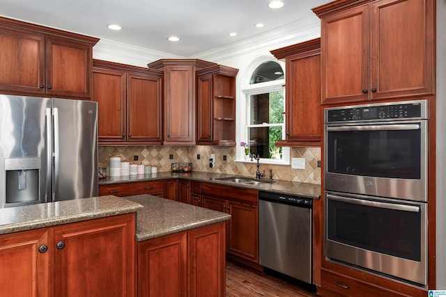 2032 Forest Meadows Cir, Birmingham, AL 35242 - kitchen featuring appliances with stainless steel finishes, open shelves, ornamental molding, dark wood finished floors, and dark stone counters