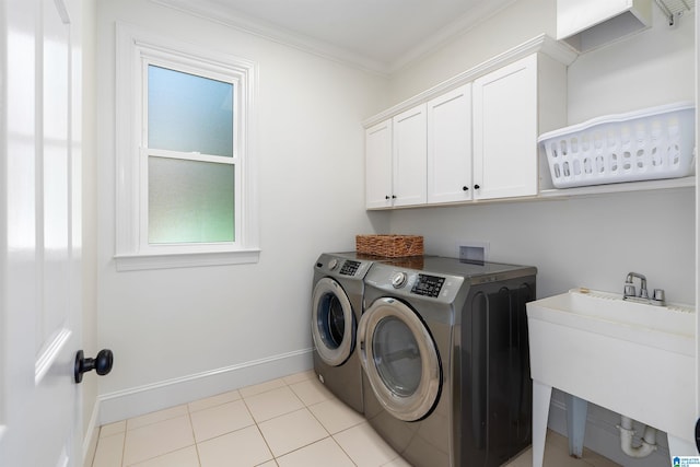 2032 Forest Meadows Cir, Birmingham, AL 35242 - laundry area with separate washer and dryer, ornamental molding, cabinet space, and light tile patterned floors