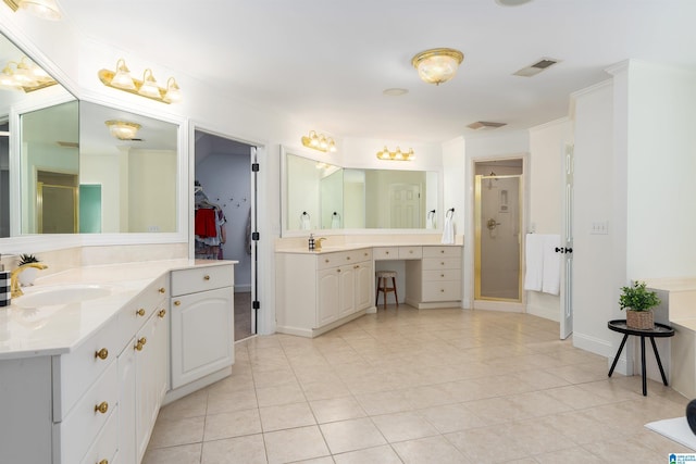 2032 Forest Meadows Cir, Birmingham, AL 35242 - full bathroom featuring a stall shower, two vanities, tile patterned floors, and a walk in closet