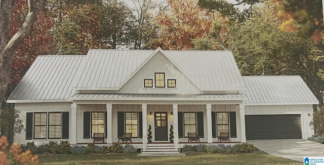 105 Barker St, Clanton, AL 35045 - view of front of property with a standing seam roof, covered porch, an attached garage, metal roof, and driveway