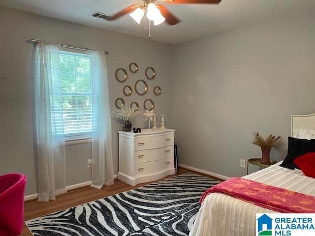 2213 Montreat Cir Unit D, Vestavia Hills, AL 35216 - bedroom featuring wood finished floors and a ceiling fan