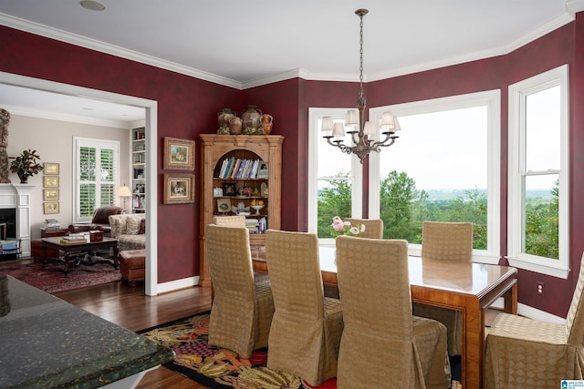5601 Canongate Ln, Birmingham, AL 35242 - dining space with dark wood-style flooring, a chandelier, baseboards, and crown molding