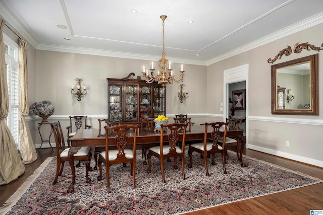 5601 Canongate Ln, Birmingham, AL 35242 - dining area with a chandelier, wood finished floors, ornamental molding, and baseboards