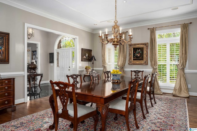 5601 Canongate Ln, Birmingham, AL 35242 - dining space with a chandelier, dark wood-style floors, healthy amount of natural light, ornamental molding, and baseboards