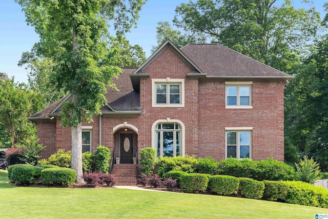 3420 Danner Cir, Vestavia Hills, AL 35243 - view of front facade with a front lawn, brick siding, and a shingled roof