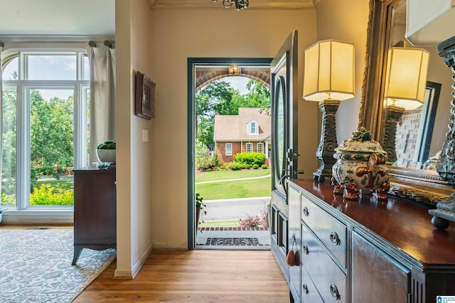 3420 Danner Cir, Vestavia Hills, AL 35243 - foyer featuring light wood-type flooring, ornamental molding, a chandelier, and baseboards