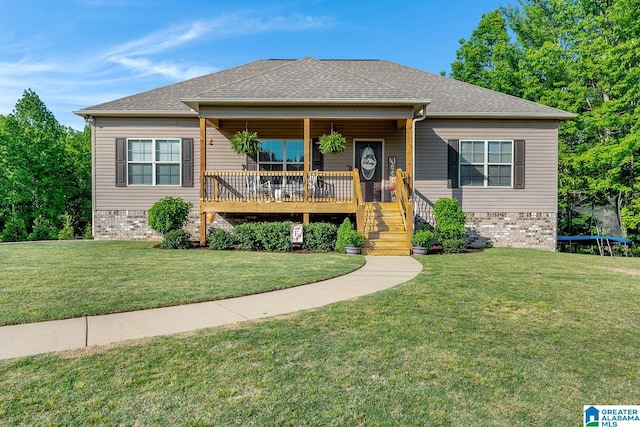 2597 Blake Way, Warrior, AL 35180 - view of front of home with a front lawn, a trampoline, stairs, and roof with shingles