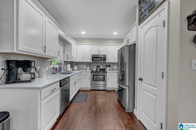 2597 Blake Way, Warrior, AL 35180 - kitchen featuring stainless steel appliances, a sink, dark wood-style flooring, white cabinets, and recessed lighting