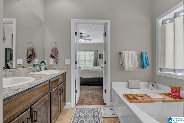 2597 Blake Way, Warrior, AL 35180 - ensuite bathroom with double vanity, a bath, a ceiling fan, and tile patterned flooring