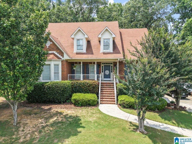 1505 Cypress Ln, Hoover, AL 35244 - cape cod house with stairway, a front lawn, and brick siding