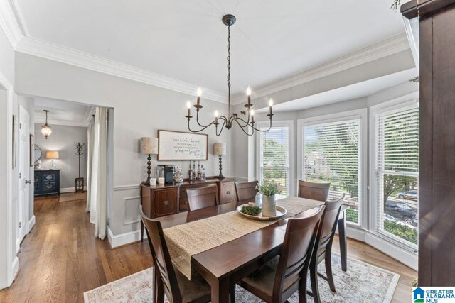 1505 Cypress Ln, Hoover, AL 35244 - dining area with healthy amount of natural light, light wood-style flooring, ornamental molding, and a chandelier