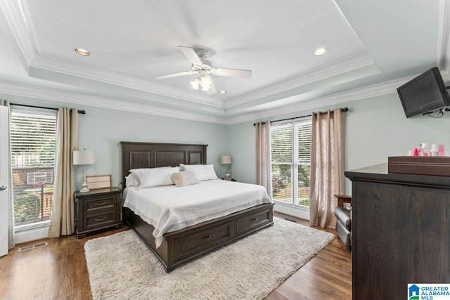 1505 Cypress Ln, Hoover, AL 35244 - bedroom featuring a raised ceiling, wood finished floors, ceiling fan, recessed lighting, and ornamental molding