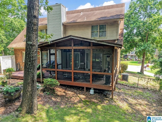 1505 Cypress Ln, Hoover, AL 35244 - back of property with a sunroom, a chimney, and brick siding