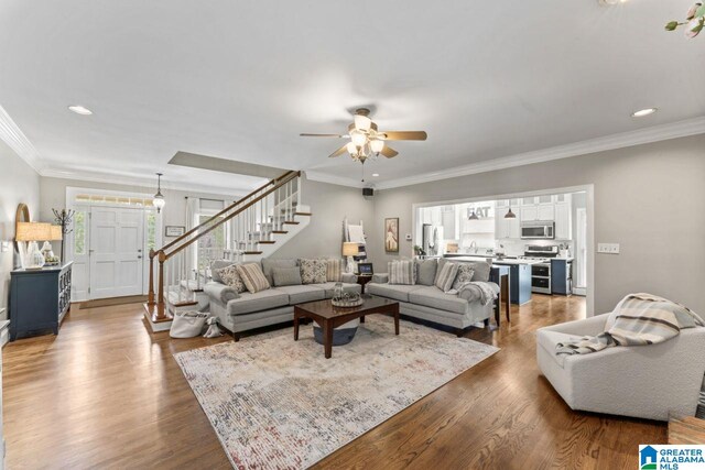 1505 Cypress Ln, Hoover, AL 35244 - living room featuring stairway, ceiling fan, wood finished floors, recessed lighting, and ornamental molding