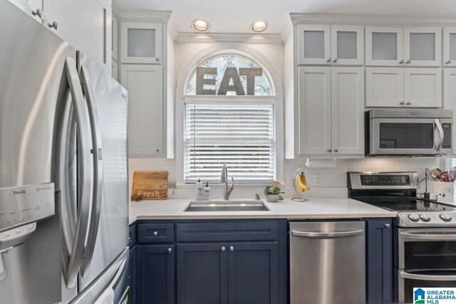 1505 Cypress Ln, Hoover, AL 35244 - kitchen featuring stainless steel appliances, a sink, light countertops, white cabinets, and backsplash