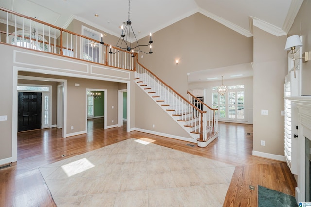 1645 Wingfield Dr, Birmingham, AL 35242 - foyer entrance with a chandelier, stairway, a towering ceiling, wood finished floors, and crown molding