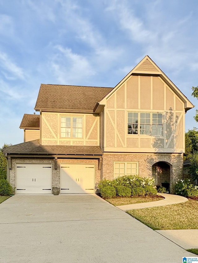 1013 Edgewater Ln, Chelsea, AL 35043 - view of front of home featuring concrete driveway, an attached garage, roof with shingles, and brick siding