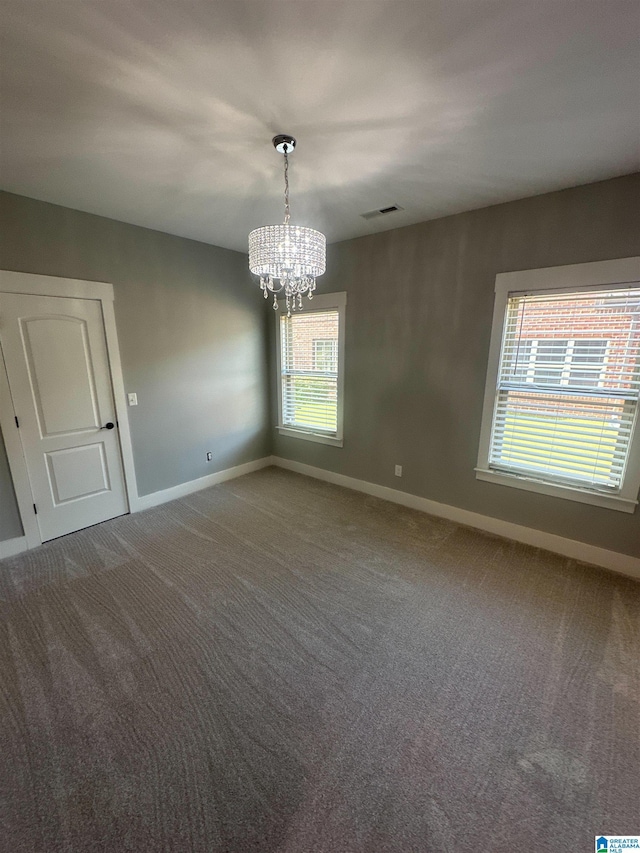 1013 Edgewater Ln, Chelsea, AL 35043 - carpeted spare room featuring baseboards and a chandelier