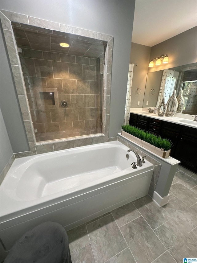 1013 Edgewater Ln, Chelsea, AL 35043 - bathroom featuring a garden tub, double vanity, and a tile shower