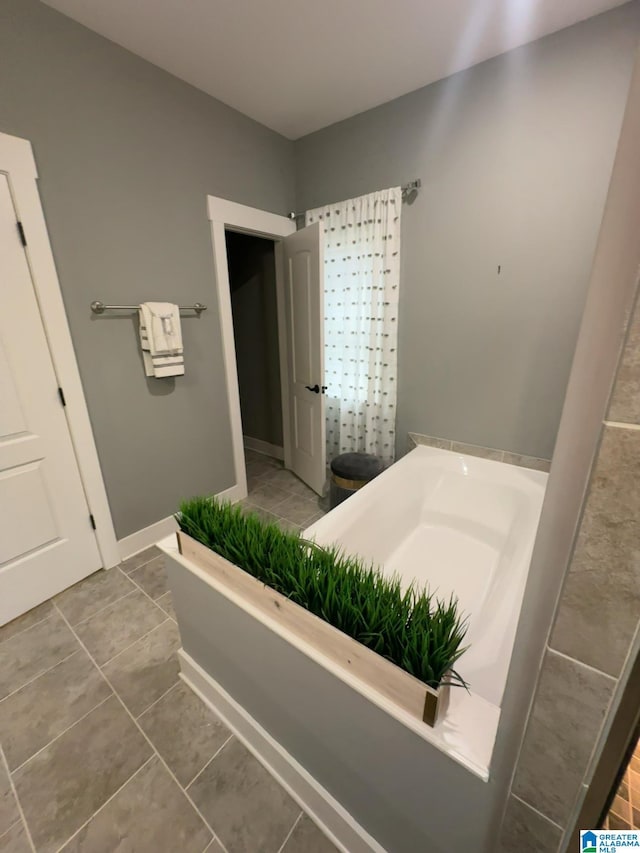 1013 Edgewater Ln, Chelsea, AL 35043 - bathroom with a bath and tile patterned floors
