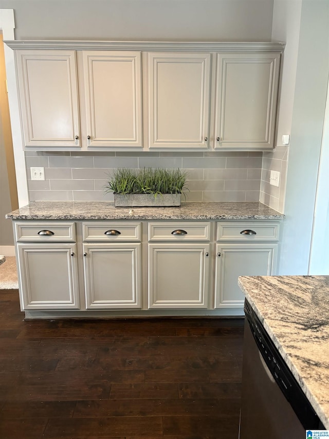 1013 Edgewater Ln, Chelsea, AL 35043 - kitchen featuring stainless steel dishwasher, dark wood finished floors, backsplash, and light stone countertops