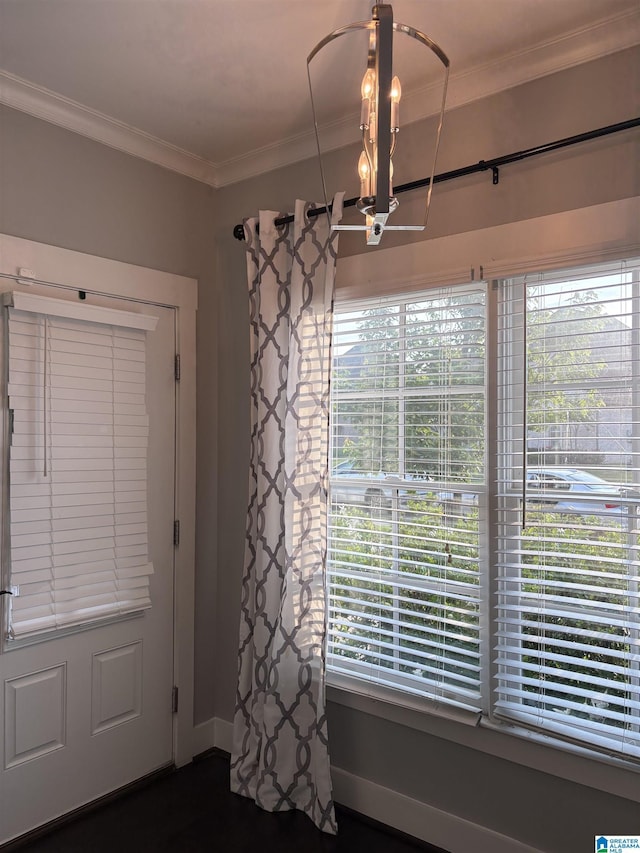1013 Edgewater Ln, Chelsea, AL 35043 - unfurnished dining area with crown molding, plenty of natural light, a chandelier, and baseboards
