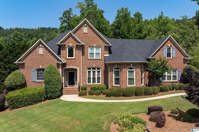 4025 Grove Park Cir, Birmingham, AL 35242 - view of front facade featuring a front yard, brick siding, and a shingled roof