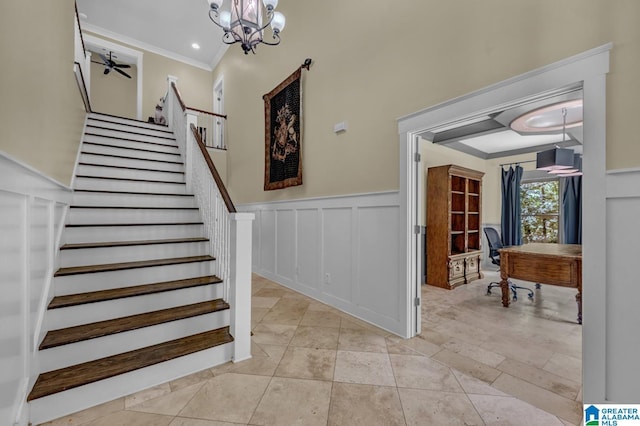 101 N Lake Dr, Hoover, AL 35242 - stairs with a decorative wall, a wainscoted wall, crown molding, and a chandelier