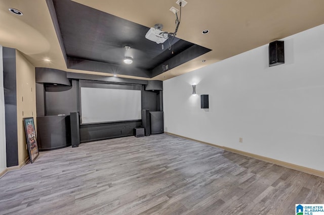 101 N Lake Dr, Hoover, AL 35242 - home theater room with a tray ceiling and wood finished floors