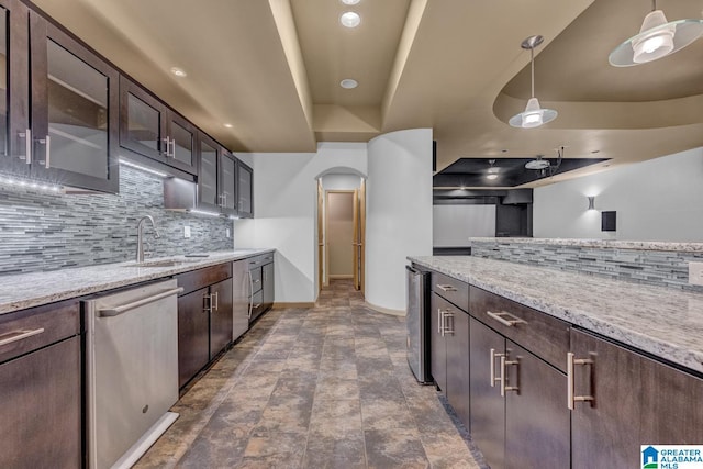 101 N Lake Dr, Hoover, AL 35242 - kitchen with dishwasher, arched walkways, decorative backsplash, beverage cooler, and dark brown cabinetry