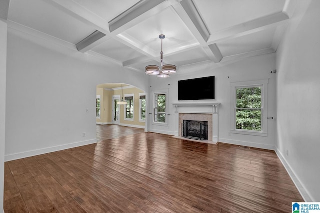 101 N Lake Dr, Hoover, AL 35242 - unfurnished living room featuring wood finished floors, a chandelier, coffered ceiling, a fireplace with flush hearth, and beam ceiling