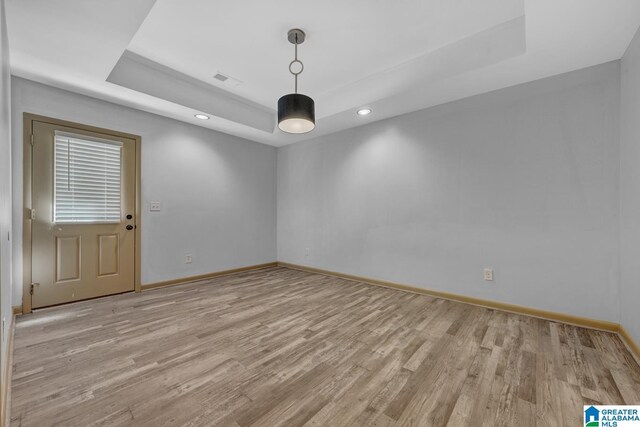 101 N Lake Dr, Hoover, AL 35242 - empty room featuring a tray ceiling, light wood finished floors, and recessed lighting