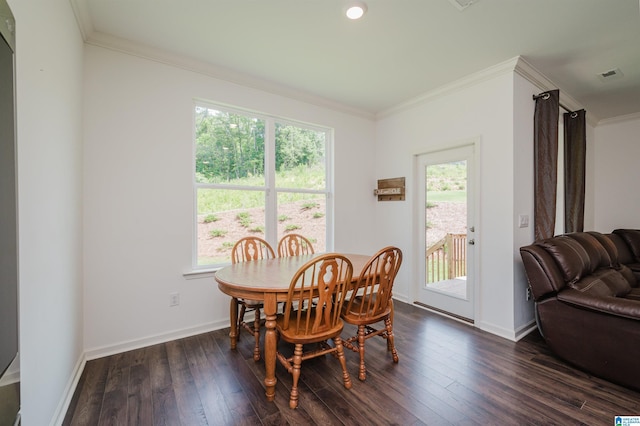 1063 Timberline Rdg, Calera, AL 35040 - dining room featuring crown molding, healthy amount of natural light, dark wood finished floors, and baseboards