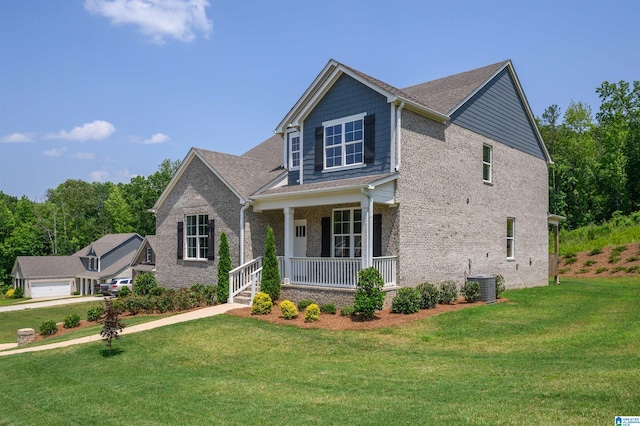 1063 Timberline Rdg, Calera, AL 35040 - craftsman inspired home with a porch, a front yard, brick siding, and central air condition unit