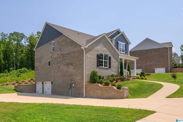 1063 Timberline Rdg, Calera, AL 35040 - view of home's exterior featuring an attached garage, a lawn, driveway, and brick siding