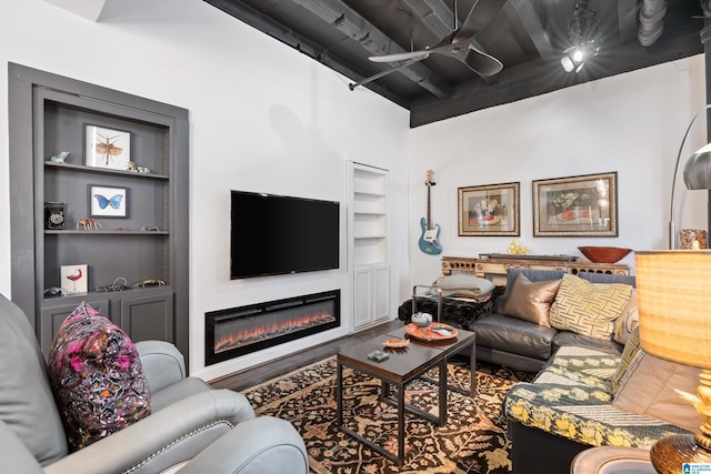 2201 1st Ave N Unit 300-C, Birmingham, AL 35203 - living room featuring built in shelves, a glass covered fireplace, and ceiling fan