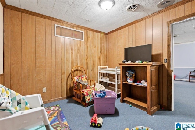 117 Trafford Rd, Warrior, AL 35180 - rec room featuring carpet, wood walls, and crown molding